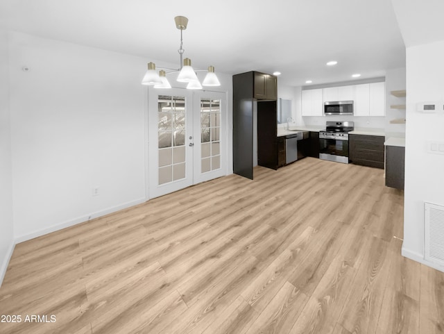 225 N Standage Unit 89, Mesa, AZ 85201 - kitchen with recessed lighting, stainless steel appliances, light wood-style floors, open shelves, and light countertops