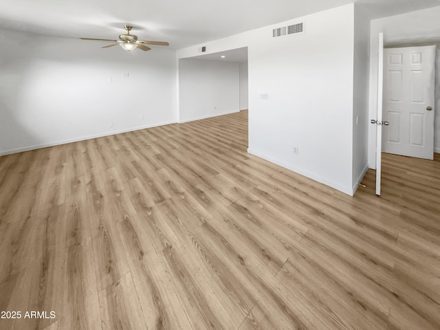 225 N Standage Unit 89, Mesa, AZ 85201 - unfurnished living room featuring visible vents, ceiling fan, baseboards, and light wood-style floors