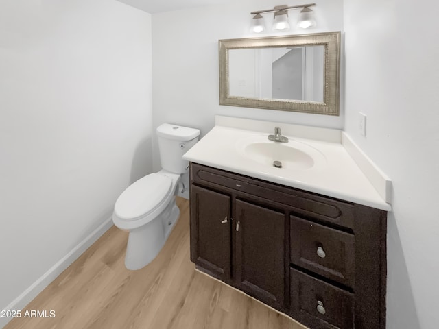 225 N Standage Unit 89, Mesa, AZ 85201 - half bath with toilet, vanity, wood finished floors, and baseboards