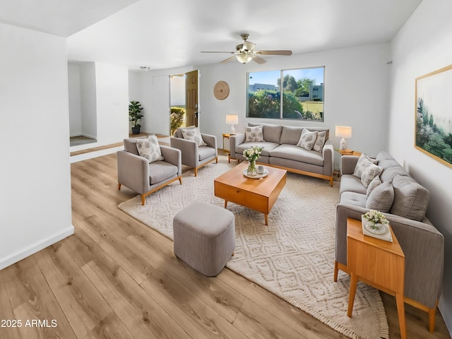 225 N Standage Unit 89, Mesa, AZ 85201 - living room featuring ceiling fan, light wood-style flooring, and baseboards