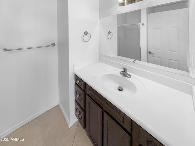 225 N Standage Unit 89, Mesa, AZ 85201 - bathroom featuring baseboards, vanity, and a shower with door