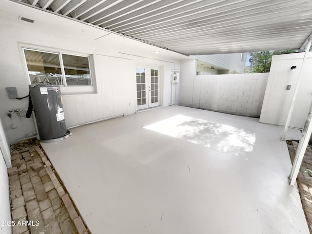 225 N Standage Unit 89, Mesa, AZ 85201 - view of patio with french doors and electric water heater