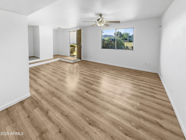 225 N Standage Unit 89, Mesa, AZ 85201 - empty room featuring a ceiling fan, baseboards, and light wood-type flooring
