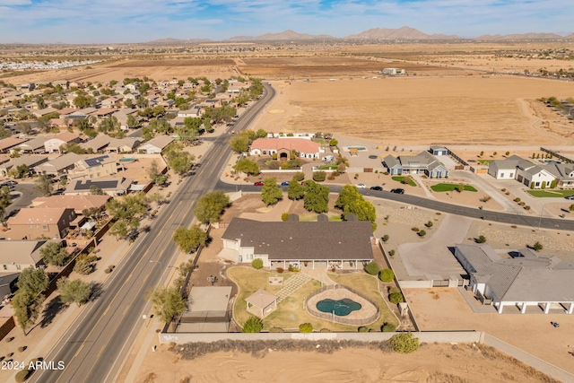 1409 E Dove Pl, Casa Grande, AZ 85122 - aerial view of property and surrounding area with mountains and nearby suburban area