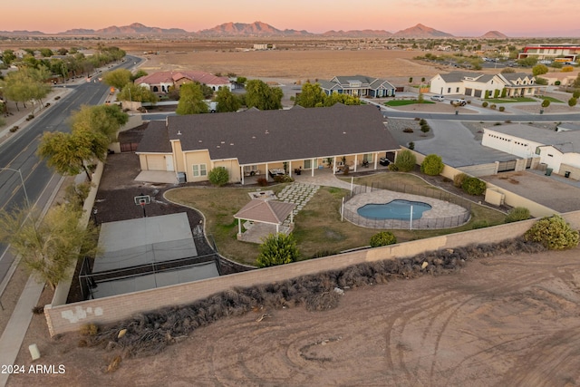 1409 E Dove Pl, Casa Grande, AZ 85122 - aerial overview of property's location featuring mountains, a pool, and nearby suburban area