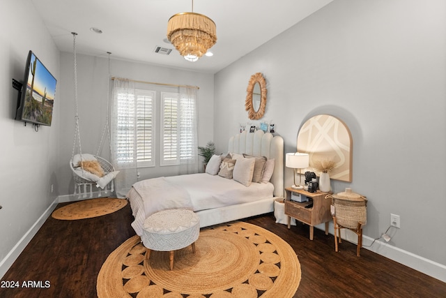 1409 E Dove Pl, Casa Grande, AZ 85122 - bedroom with baseboards, wood finished floors, and a chandelier