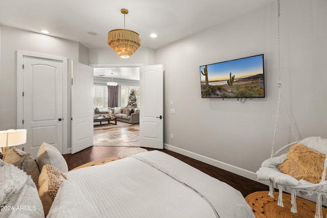 1409 E Dove Pl, Casa Grande, AZ 85122 - bedroom with wood finished floors, baseboards, recessed lighting, and a chandelier