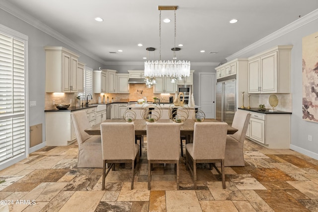 1409 E Dove Pl, Casa Grande, AZ 85122 - dining area featuring stone tile floors, ornamental molding, recessed lighting, baseboards, and a chandelier