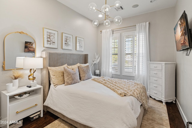 1409 E Dove Pl, Casa Grande, AZ 85122 - bedroom with dark wood-style floors, a chandelier, and baseboards