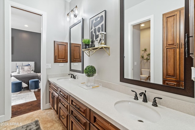 1409 E Dove Pl, Casa Grande, AZ 85122 - bathroom featuring double vanity, toilet, and tile patterned flooring