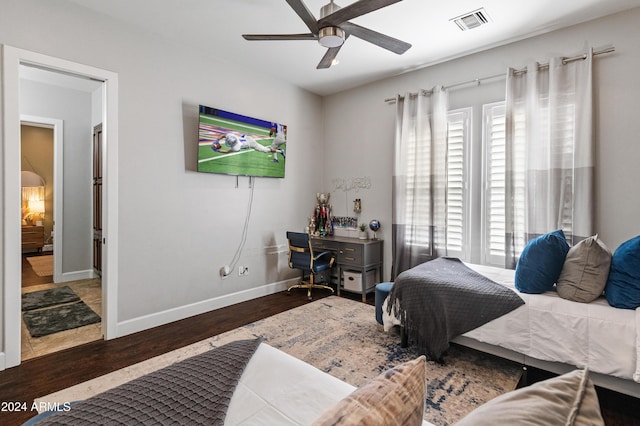 1409 E Dove Pl, Casa Grande, AZ 85122 - bedroom featuring multiple windows, wood finished floors, a desk, and baseboards