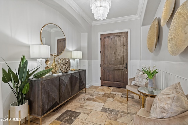 1409 E Dove Pl, Casa Grande, AZ 85122 - entryway with stone tile floors, a chandelier, crown molding, and wainscoting