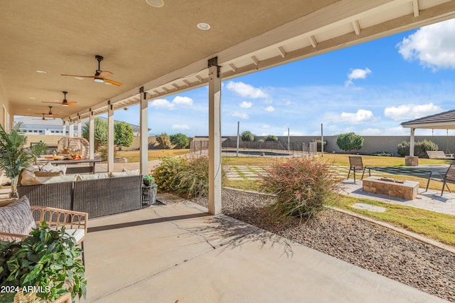 1409 E Dove Pl, Casa Grande, AZ 85122 - view of patio / terrace featuring a ceiling fan and an outdoor living space with a fire pit
