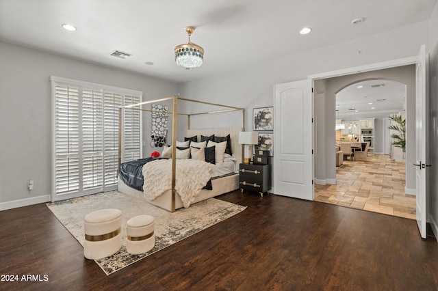 1409 E Dove Pl, Casa Grande, AZ 85122 - bedroom with arched walkways, wood finished floors, baseboards, and recessed lighting