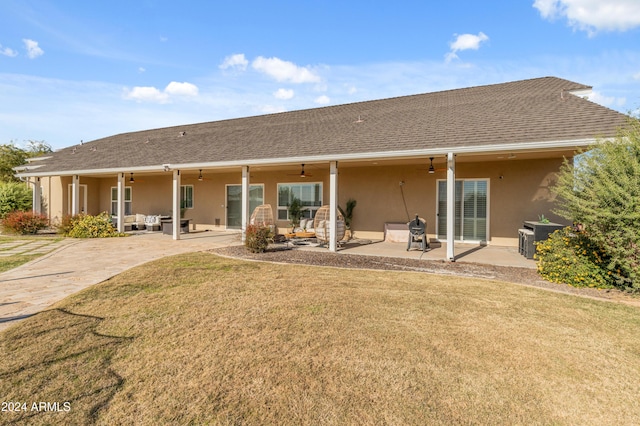 1409 E Dove Pl, Casa Grande, AZ 85122 - rear view of house with stucco siding, ceiling fan, a lawn, and a patio
