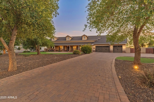 1409 E Dove Pl, Casa Grande, AZ 85122 - view of front of home featuring a garage, decorative driveway, and a porch