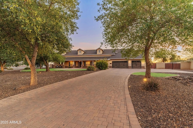 1409 E Dove Pl, Casa Grande, AZ 85122 - view of front of home with decorative driveway, covered porch, and a garage