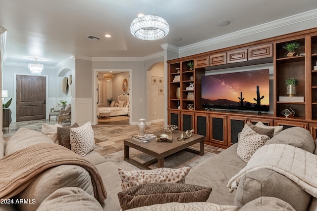 1409 E Dove Pl, Casa Grande, AZ 85122 - living room with a chandelier, arched walkways, and ornamental molding