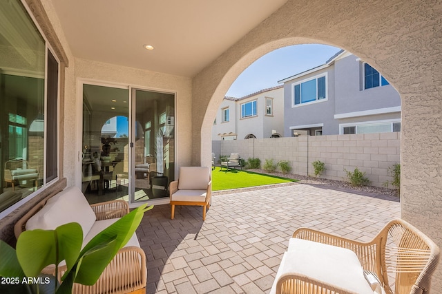 view of patio featuring fence