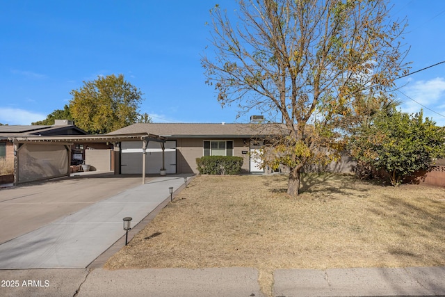 single story home with a front yard and a garage