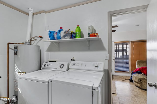 clothes washing area with separate washer and dryer, light tile patterned floors, and gas water heater