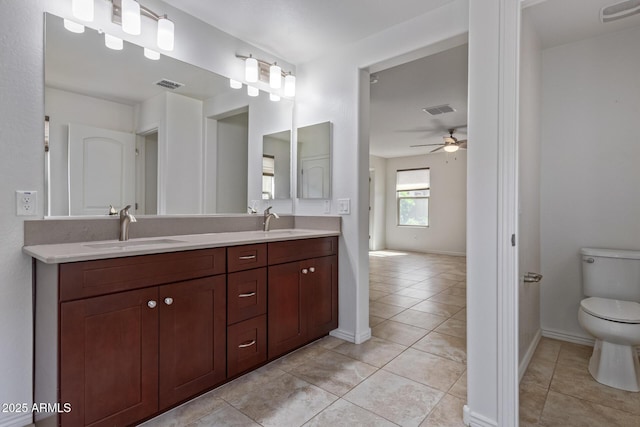 full bath with toilet, visible vents, a sink, and tile patterned floors