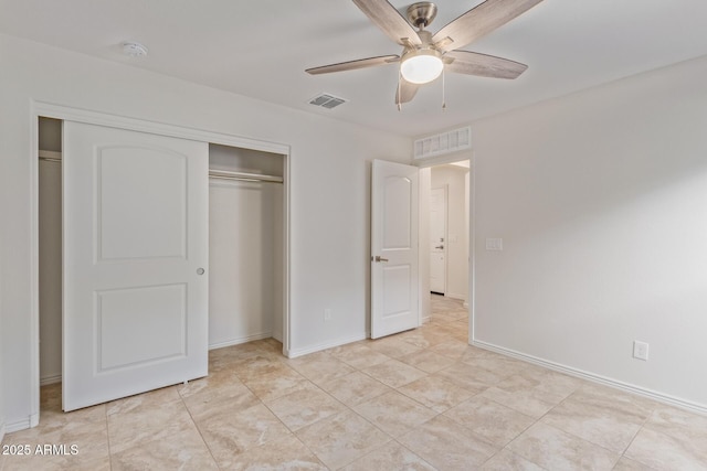 unfurnished bedroom with a ceiling fan, a closet, visible vents, and baseboards