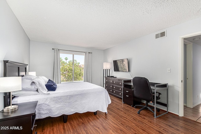 540 N May Unit 3117, Mesa, AZ 85201 - bedroom with wood finished floors, a textured ceiling, and an office area