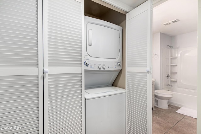 540 N May Unit 3117, Mesa, AZ 85201 - laundry area with estacked washer and dryer and light tile patterned floors