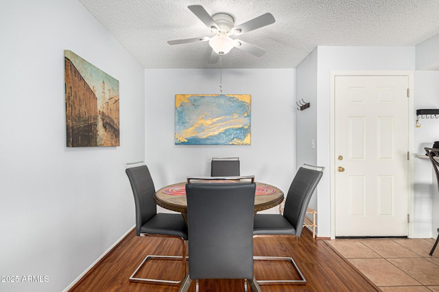 540 N May Unit 3117, Mesa, AZ 85201 - dining area featuring a ceiling fan, wood finished floors, a textured ceiling, and baseboards