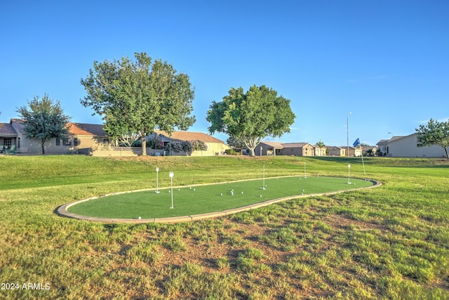 view of home's community with a yard