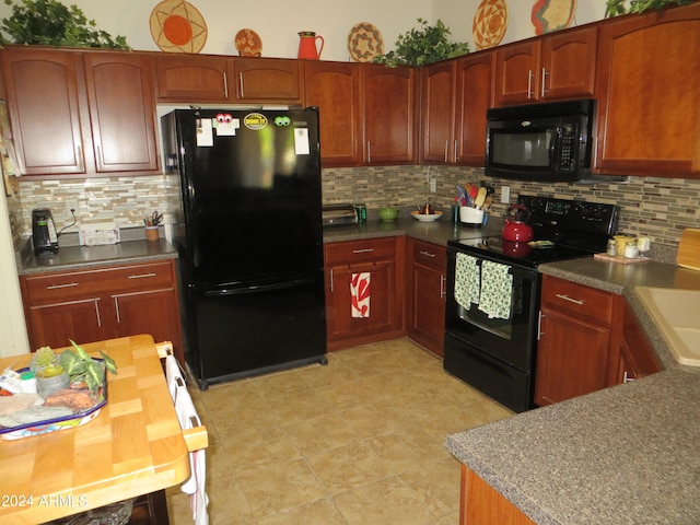 kitchen with backsplash, black appliances, and light tile patterned flooring