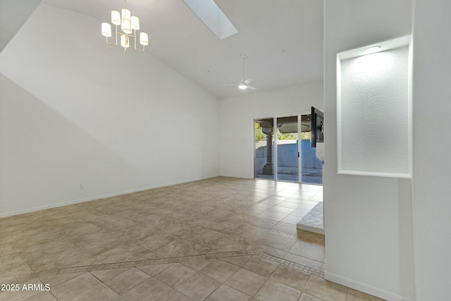 unfurnished room featuring a skylight, baseboards, high vaulted ceiling, and ceiling fan with notable chandelier