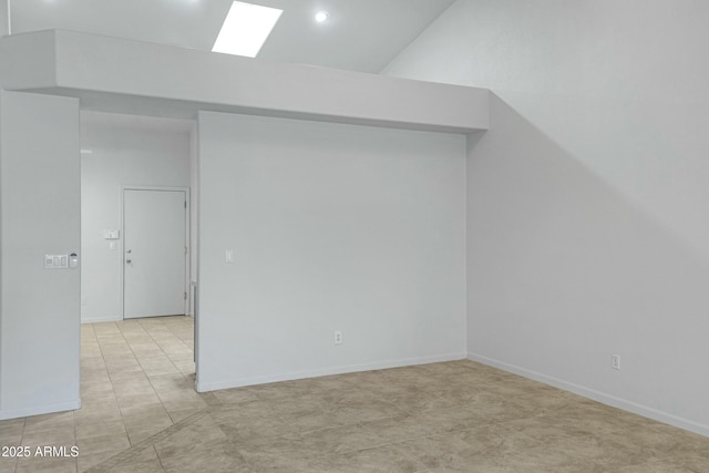 additional living space featuring baseboards