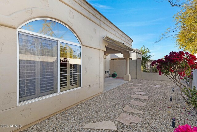 view of yard with fence and a patio