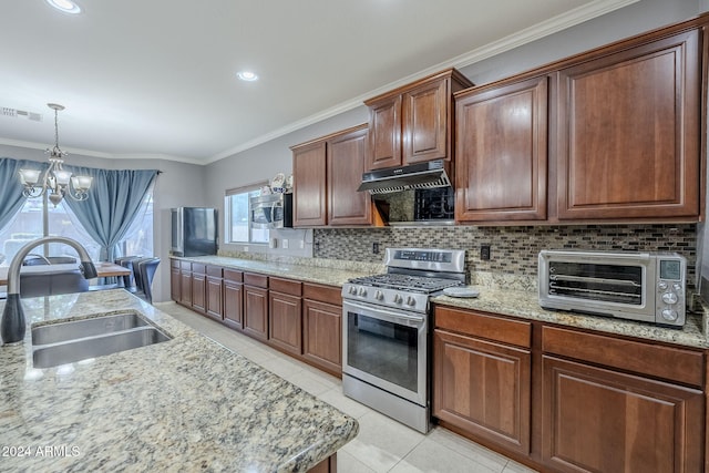 kitchen featuring ornamental molding, gas stove, sink, light tile patterned floors, and a chandelier