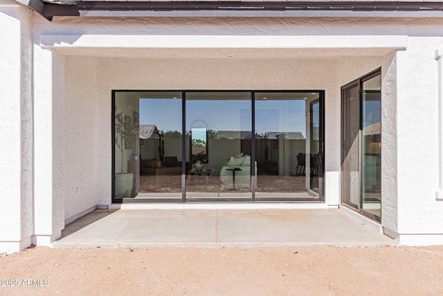 property entrance with a patio area