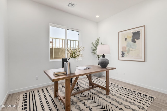 office area with hardwood / wood-style flooring