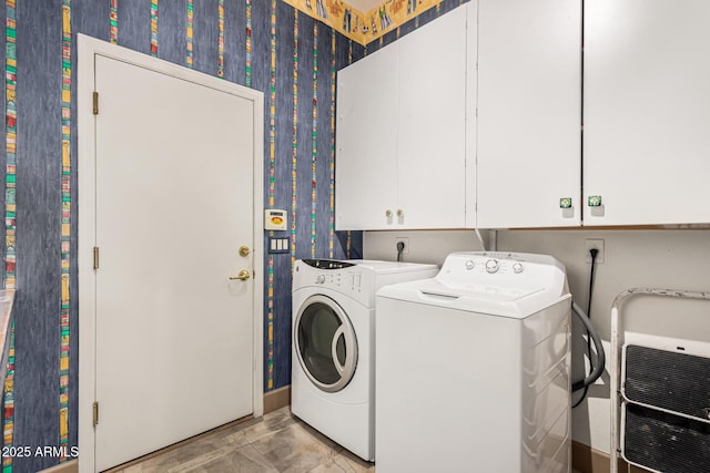 clothes washing area with separate washer and dryer, heating unit, and cabinets