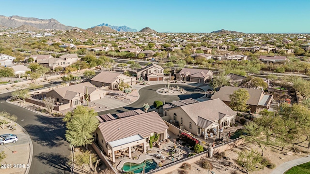 birds eye view of property featuring a mountain view