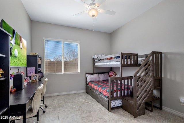 bedroom featuring ceiling fan and baseboards