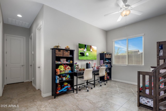 office space featuring baseboards, visible vents, and ceiling fan