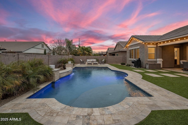 view of pool with a patio, a fenced backyard, an outdoor living space, and a fenced in pool