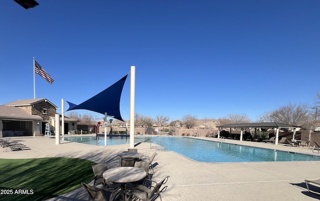 pool featuring a patio and fence