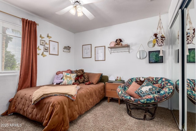 carpeted bedroom featuring ceiling fan