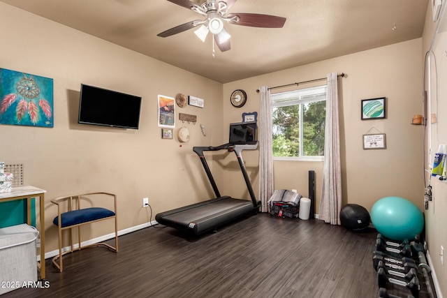 workout area with baseboards, wood finished floors, and ceiling fan