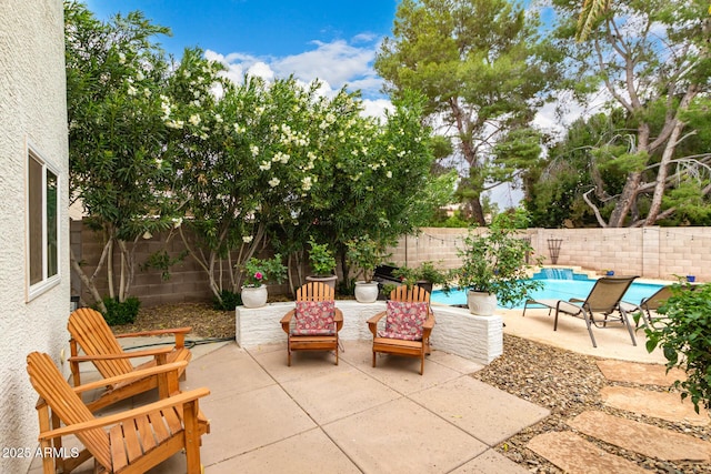 view of patio featuring a fenced backyard and a fenced in pool