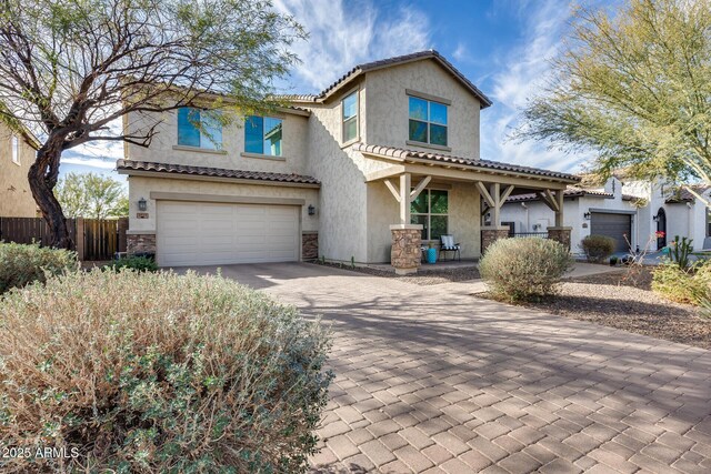 view of front of property with a garage and a porch