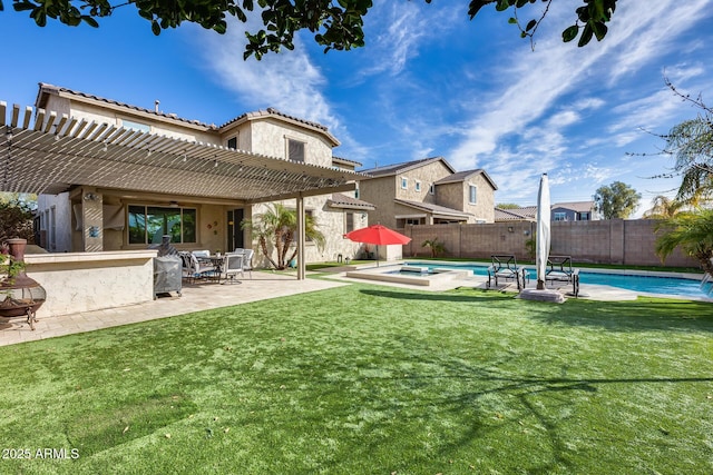 view of yard featuring a pool with hot tub, an outdoor bar, a patio area, and a pergola