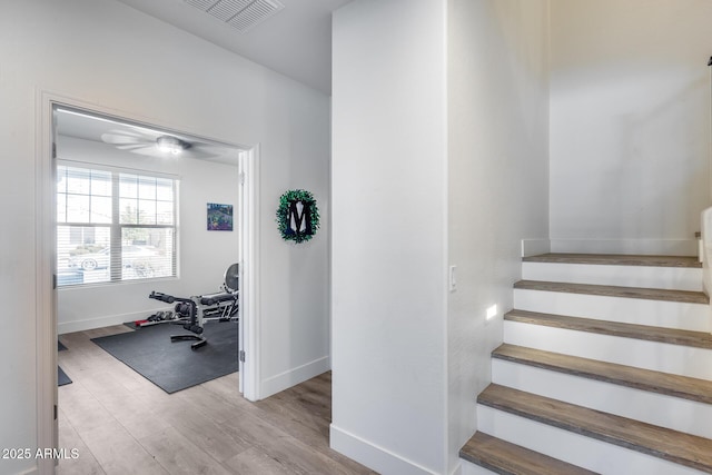 stairs with wood-type flooring